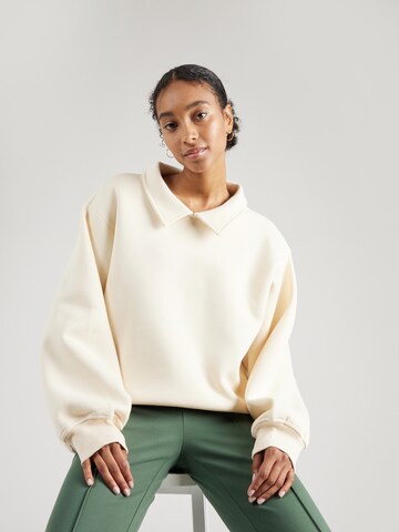 florence by mills exclusive for ABOUT YOU Sweatshirt 'Joy' in Beige: front