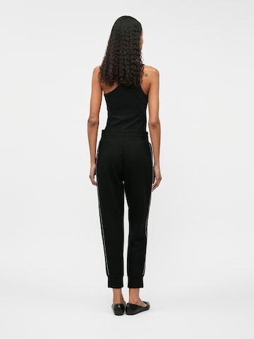 GUESS Tapered Hose 'VICTOIRE' in Schwarz