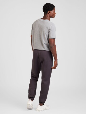 Champion Authentic Athletic Apparel Tapered Trousers in Grey