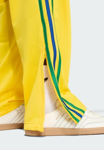 ADIDAS ORIGINALS Loosefit Hose 'Firebird' in Gelb