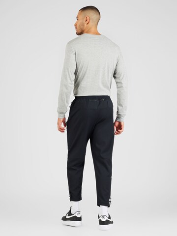 NIKE Tapered Workout Pants in Black