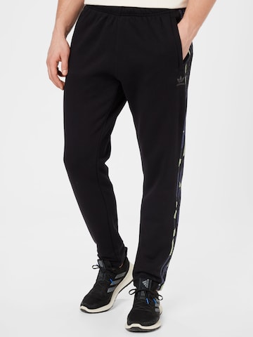 ADIDAS ORIGINALS Zwężany krój Spodnie 'Graphics Camo Sweat' w kolorze czarny: przód