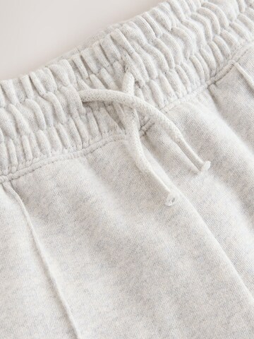 Next - Perna larga Calças em cinzento