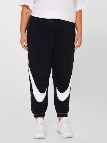 Nike Sportswear Tapered Workout Pants in Black: front