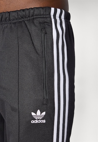 ADIDAS ORIGINALS Slimfit Nadrág 'Adicolor Classics Beckenbauer' - fekete