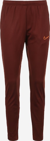 NIKE Skinny Workout Pants in Brown: front