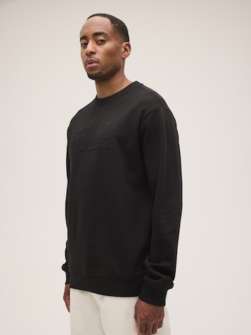 FILA Sweatshirt 'COREDO relaxed varsity brushed sweatshirt' in Zwart: voorkant