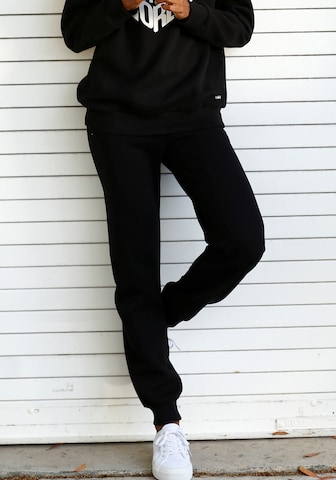 BUFFALO Tapered Trousers in Black: front