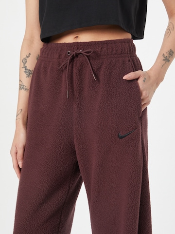 Nike Sportswear Zvonové kalhoty Sportovní kalhoty – červená