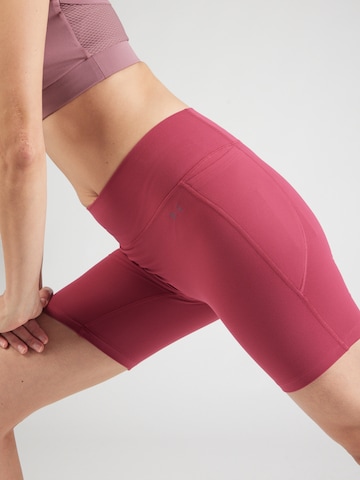 UNDER ARMOUR - Skinny Pantalón deportivo 'Motion' en rojo