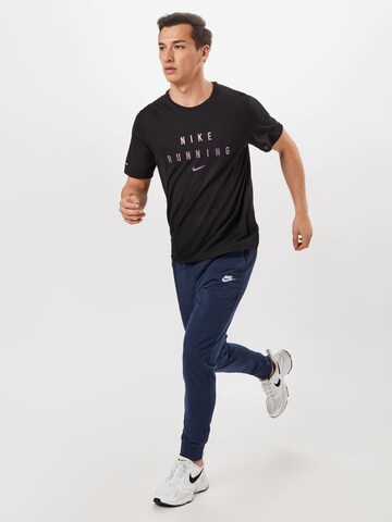 NIKE Functioneel shirt 'Miler Run Division' in Zwart