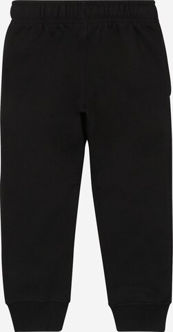 Tapered Pantaloni 'Club' de la Nike Sportswear pe negru