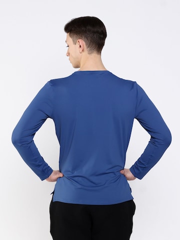 neverover - Camiseta funcional en azul