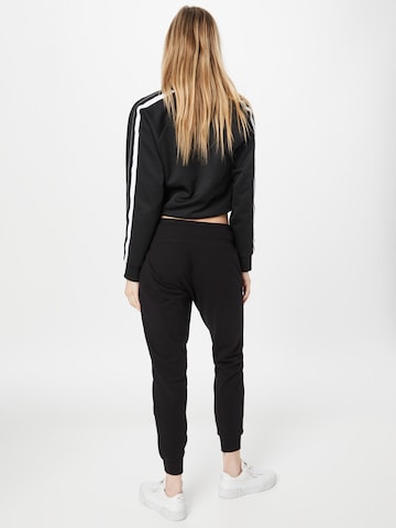 Effilé Pantalon de sport DKNY Performance en noir