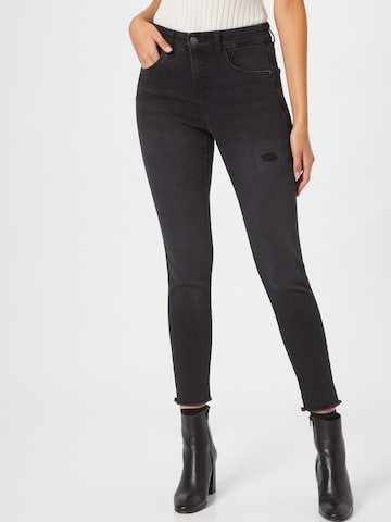 Cartoon Skinny Jeans in Black: front