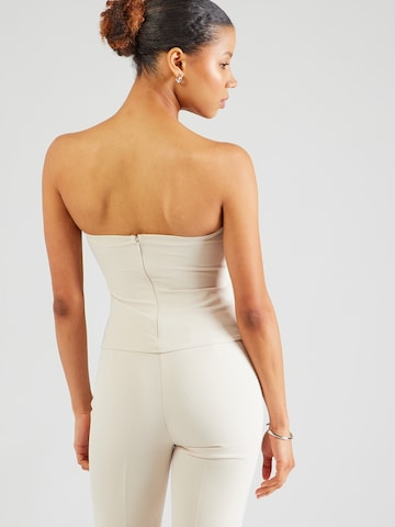 Haut millane en beige