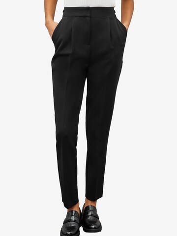 Slimfit Pantaloni con pieghe di Next in nero: frontale