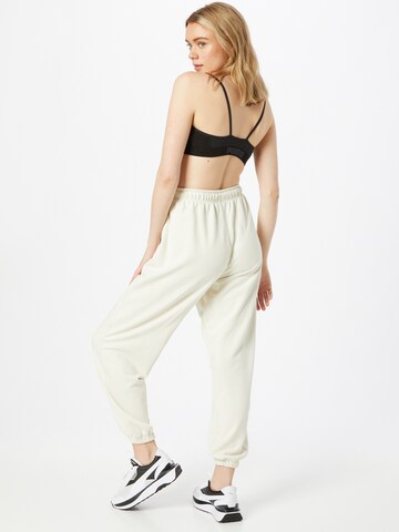 PUMA Tapered Workout Pants in Beige