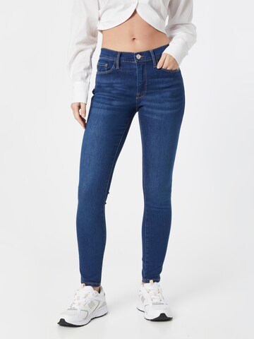 FRAME Skinny Jeans in Blue: front