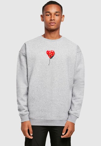 Merchcode Sweatshirt 'Banksy - Love Hurts' in Grey: front