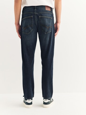 Coupe slim Jean 'Motion Flex' Next en bleu