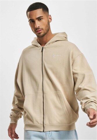 Veste de survêtement Karl Kani en beige : devant