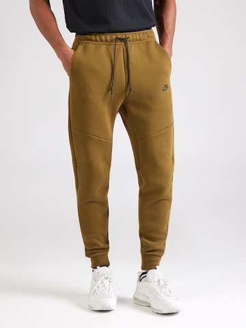 Effilé Pantalon 'TCH FLC' Nike Sportswear en vert : devant