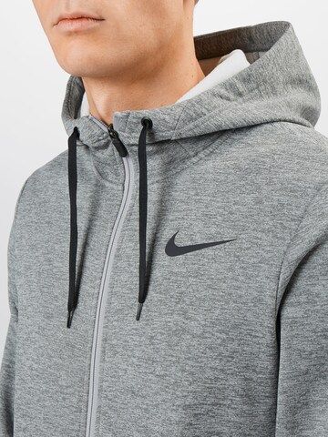 NIKE Sports sweat jacket 'Therma' in Grey