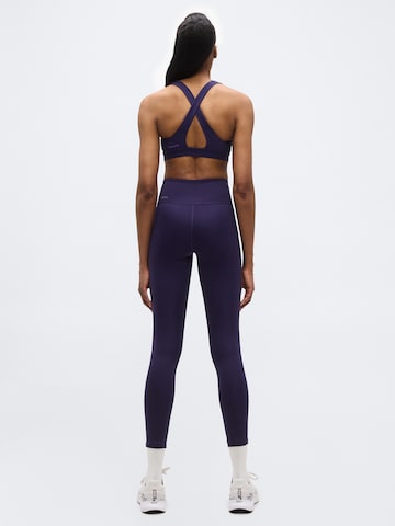 PUMA Skinny Sportbroek 'TAD ESSENTIAL' in Lila: terug