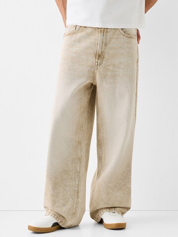 Bershka Wide leg Jeans in Beige: front