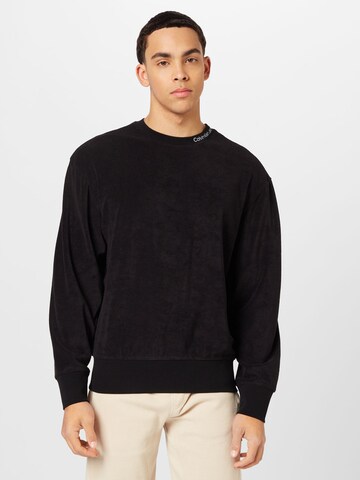 Sweat-shirt Calvin Klein Jeans en noir : devant