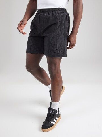 Regular Pantaloni '2000' de la ADIDAS ORIGINALS pe negru: față