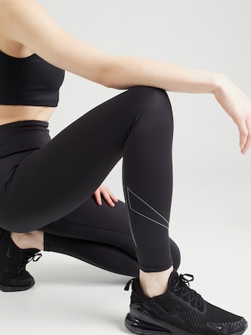 Reebok Skinny Sportovní kalhoty 'LUX BOLD' – černá