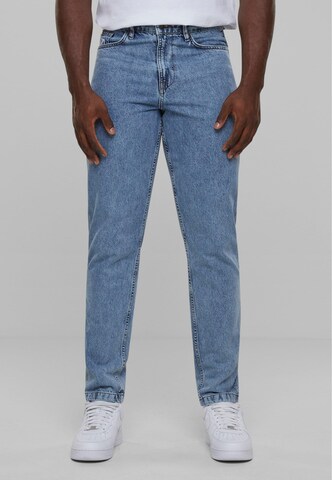 Karl Kani Tapered Jeans in Blue: front