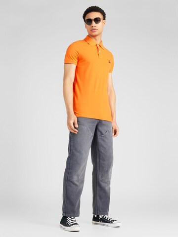 UNITED COLORS OF BENETTON Poloshirt in Orange