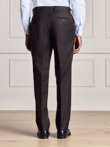 Slimfit Pantaloni con piega frontale di Next in marrone
