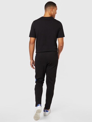 Regular Pantalon de sport 'Tiro Winterized' ADIDAS SPORTSWEAR en noir