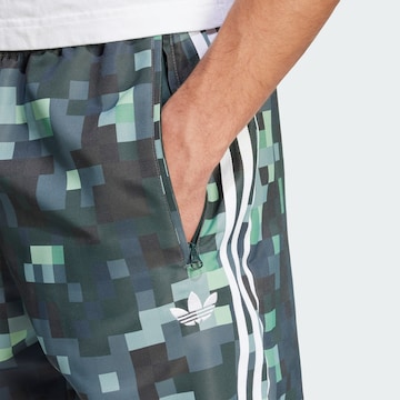 ADIDAS ORIGINALSTapered Sportske hlače 'Аdidas Originals x Minecraft' - zelena boja