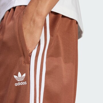 Baggy Pantaloni 'Adicolor Firebird' di ADIDAS ORIGINALS in marrone