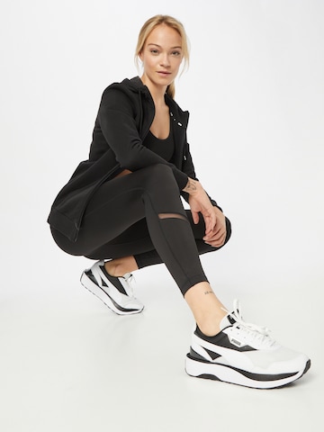 PUMA Skinny Sportsbukse 'Exhale' i svart