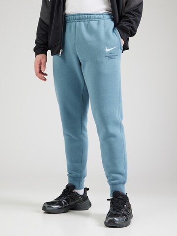 Nike Sportswear Tapered Broek in Blauw: voorkant