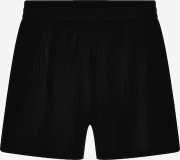 SASSYCLASSY Loose fit Trousers in Black: front