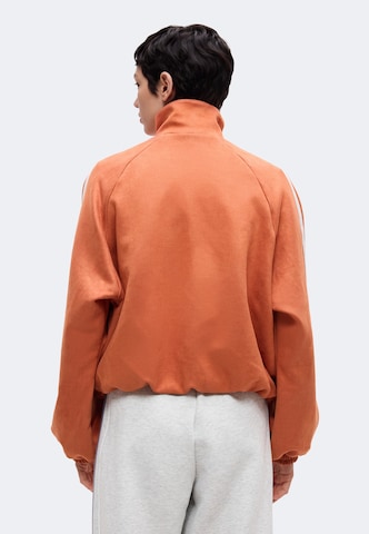 ADIDAS ORIGINALS Välikausitakki 'Adilenium Season 6' värissä punainen