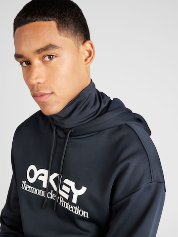 OAKLEY Αθλητική μπλούζα φούτερ 'RIDER LONG 2.0' σε μαύρο