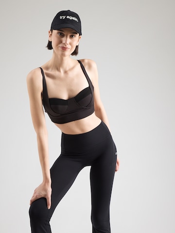 HRMN8 Õlapaelteta topp Spordirinnahoidja 'FORM', värv must: eest vaates