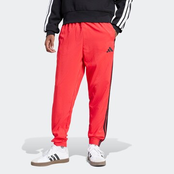 Tapered Pantaloni sportivi 'Essentials' di ADIDAS SPORTSWEAR in rosso: frontale
