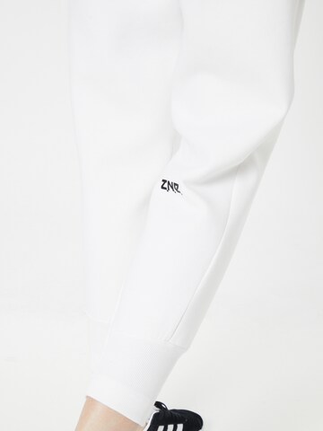 ADIDAS SPORTSWEAR - Tapered Pantalón deportivo 'Z.N.E.' en blanco