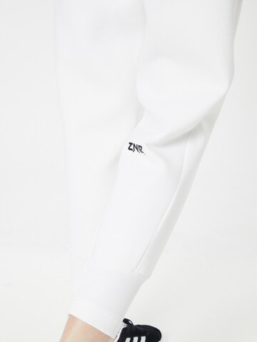 ADIDAS SPORTSWEAR - Tapered Calças de desporto 'Z.N.E.' em branco