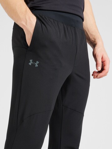 UNDER ARMOUR Tapered Sportbroek in Zwart