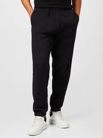 Obey Tapered Pants in Black: front